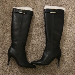 Black Calvin Klein boots with gold accents